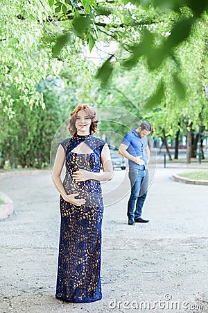 Funny image. Happy pregnant woman with husband standing together Stock Photo