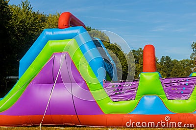 Funny in an inflatable castle slides colorful in playground Stock Photo