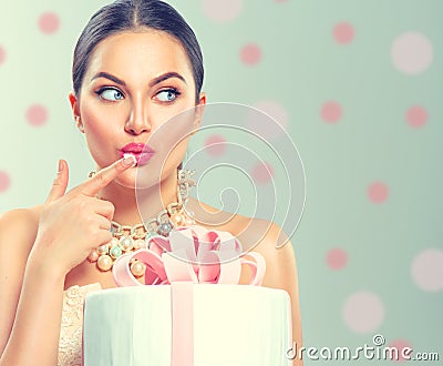 Funny joyful beauty model girl holding big beautiful party or birthday cake Stock Photo