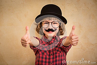 Funny kid with fake mustache Stock Photo