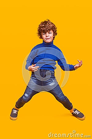 Funny kid pretending to play guitar Stock Photo