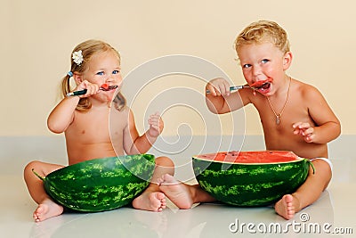 Funny kids eating watermelon Stock Photo