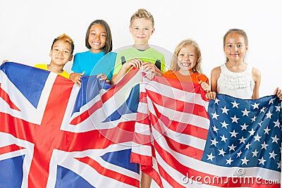 Funny kids holding flag Great Britain and american national flag Stock Photo