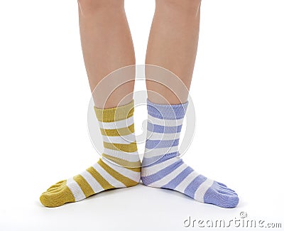 Funny legs in socks of different colors Stock Photo