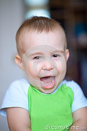 Funny little boy showing emotions, laughing. Caucasian child 2 years old. Closeup portriat. Stock Photo