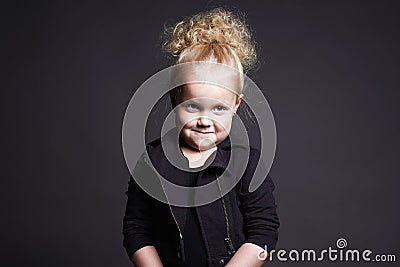 Funny little girl. grimace face child Stock Photo