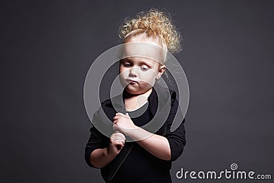 Funny little girl. grimace face child. portrait of emotion kid Stock Photo