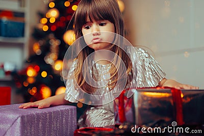 Funny Little Girl Reacting Surprised to her Christmas Presents Stock Photo