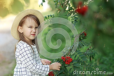 A funny little kid makes a discontented face grimace. Sense of humor. Stock Photo