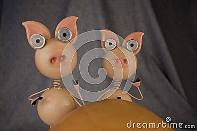 Funny little pigs on a dark background Stock Photo