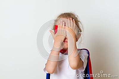 Funny little power super hero child in a red raincoat. Super hero concept. Stock Photo