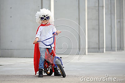 A funny, little superhero. Concept boy imagination. Happy childchood. Stock Photo