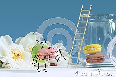 Funny macarons are portraying couple in love. Stock Photo