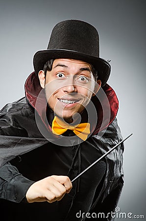 Funny magician man with wand and hat Stock Photo