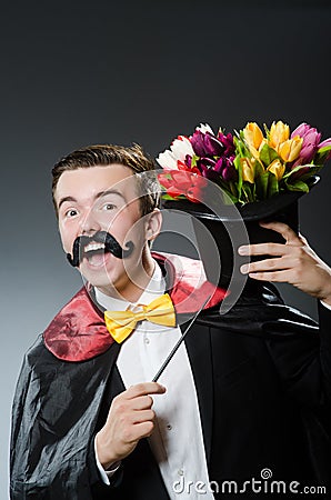 Funny magician with wand Stock Photo