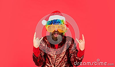 Funny man with beard. Christmas spirit. Cheerful clown colorful hairstyle. Winter holidays. Sorry Santa, Naughty just Stock Photo