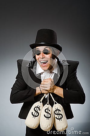 The funny man with dollar sacks Stock Photo