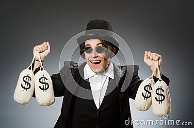 The funny man with dollar sacks Stock Photo