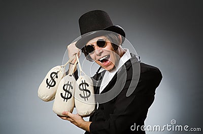 The funny man with dollar sacks Stock Photo