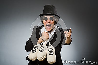 The funny man with dollar sacks Stock Photo