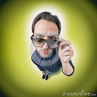 Funny man looking through his sunglasses Stock Photo