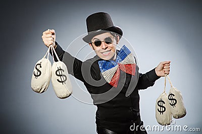 The funny man with money dollar sacks Stock Photo