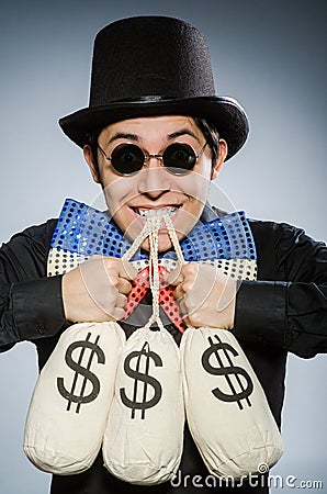 The funny man with money dollar sacks Stock Photo