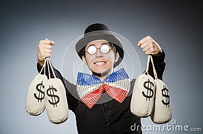 The funny man with money dollar sacks Stock Photo