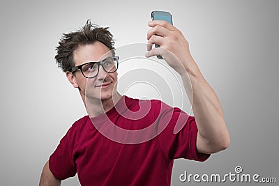 Funny man photographing himself on a smartphone Stock Photo