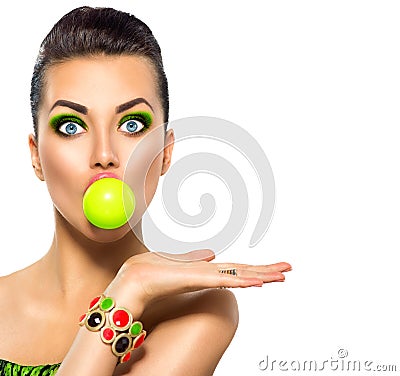 Funny model girl with green bubble of chewing gum Stock Photo