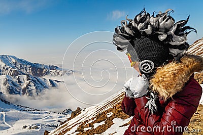 Funny mohawk hat woman in mountains traveling Stock Photo