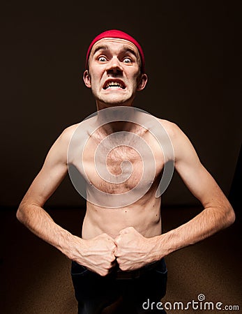 Funny nerd showing his biceps Stock Photo