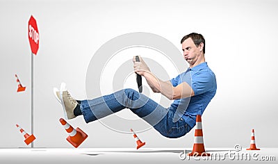 Funny novice man car driver with a wheel Stock Photo