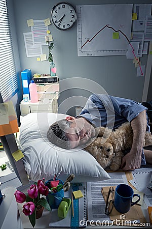 Funny office worker sleeping at work Stock Photo