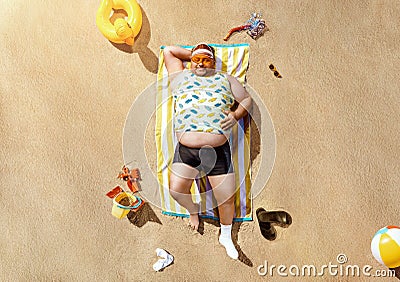 Funny overweight tourist resting on the beach Stock Photo