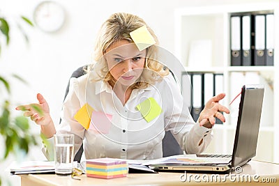 Funny overworked business woman working in office Stock Photo