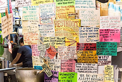 Funny paper signs at a restaurant. Editorial Stock Photo