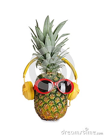 Funny pineapple with headphones and sunglasses Stock Photo