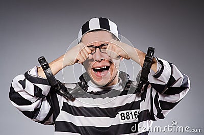 Funny prisoner in chains isolated on gray Stock Photo