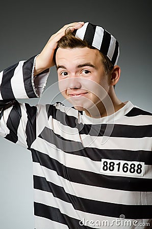 Funny prisoner in prison concept Stock Photo