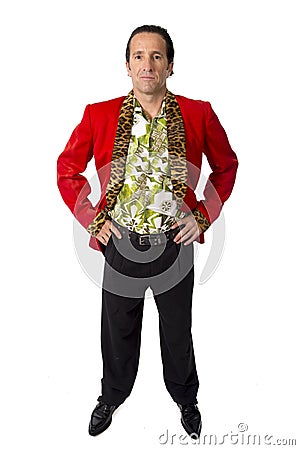 Funny rake playboy and bon vivant mature man wearing red casino jacket and Hawaiian shirt standing happy posing gigolo alike Stock Photo
