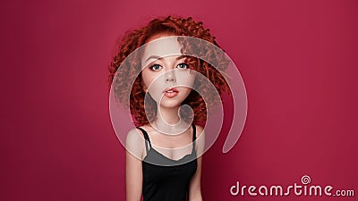 Funny red curly girl with big head and funny hairstyle. Caricature stylization of female logic Stock Photo