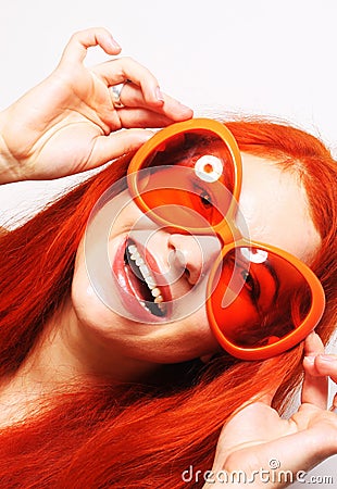Funny redhair woman in big orange glasses Stock Photo