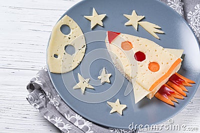 Funny sandwich with rocket and stars made of cheese, carrot and paprika, meal for kids idea Stock Photo