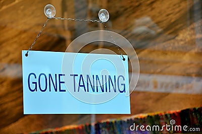 Funny sign: gone tanning Stock Photo