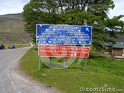 Funny sign with too much information and a lot of stickers. Road to applecross bealach na ba shieldaig kenmore hairpin . Stock Photo