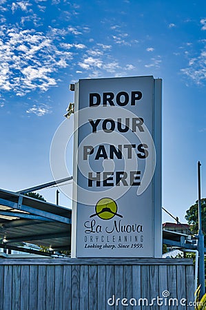 Funny signboard of a dry cleaners Editorial Stock Photo