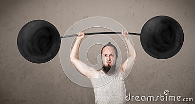 Funny skinny guy lifting weights Stock Photo