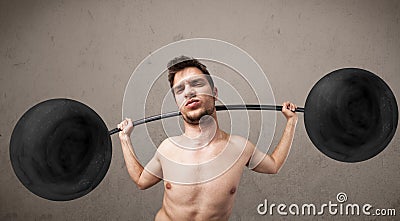 Funny skinny guy lifting weights Stock Photo