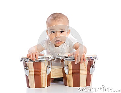 Funny smiling baby with bongos Stock Photo